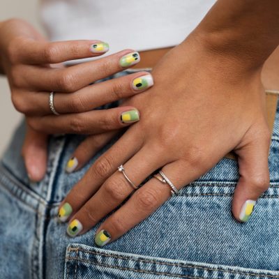 woman-showing-her-nail-art-fingernails